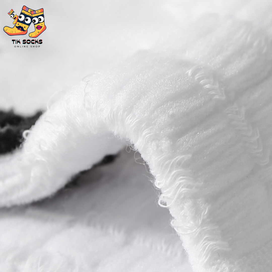 white, and black combed cotton socks displayed side by side, highlighting their superior softness and quality.