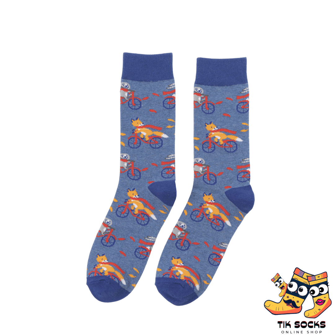 Men's and women's socks depicting animated foxes in racing poses, darting across a track-like background with flags and finish lines
