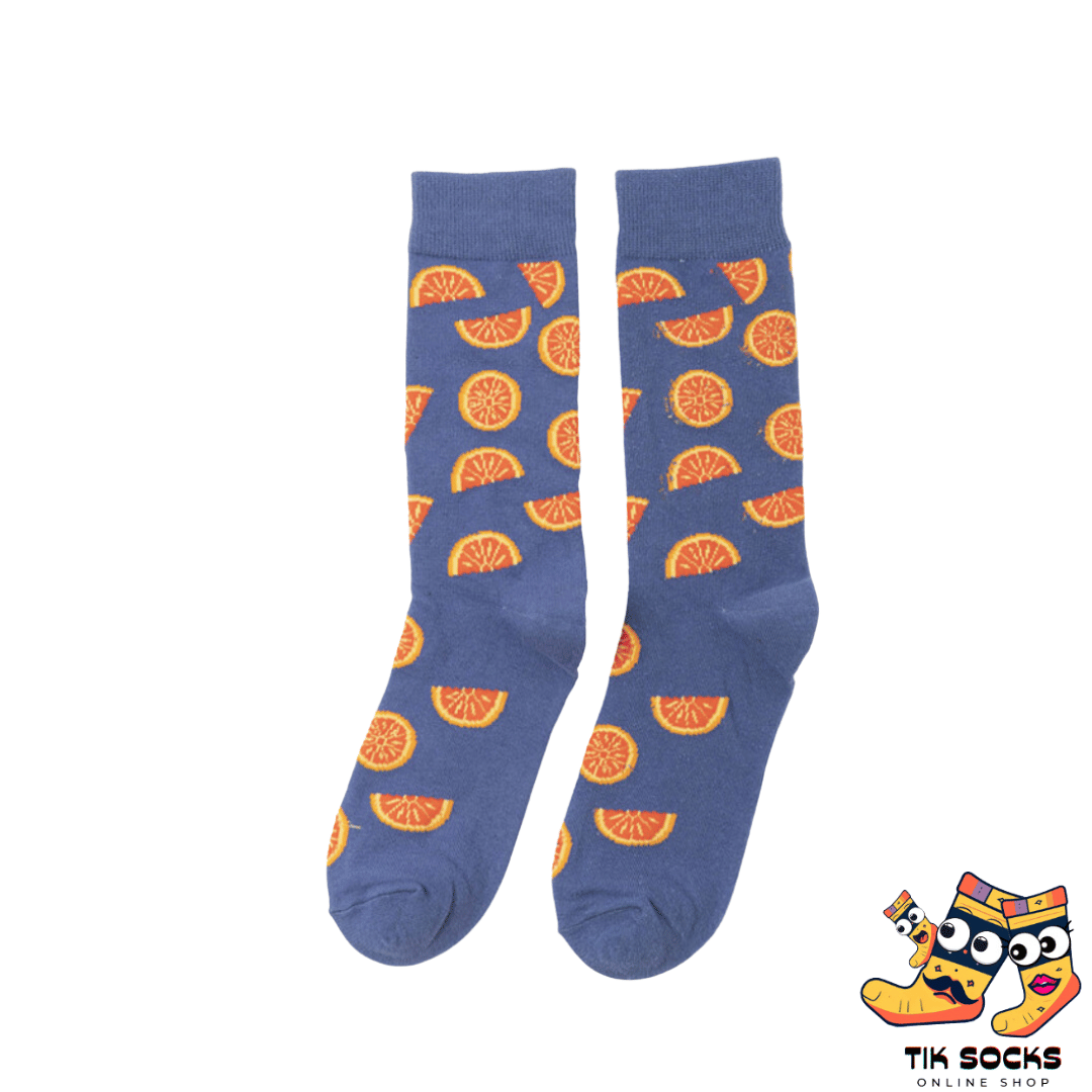 Men's and women's socks featuring vibrant illustrations of ripe oranges, both whole and sliced, set against a citrus-themed background