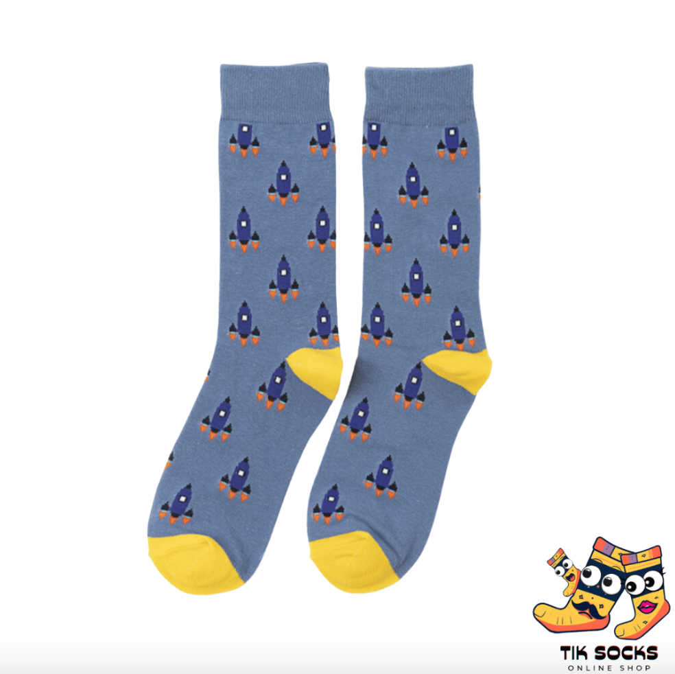 Men's and women's socks adorned with illustrations of rockets soaring through space, with flames and stars in the backdrop, capturing the spirit of space exploration