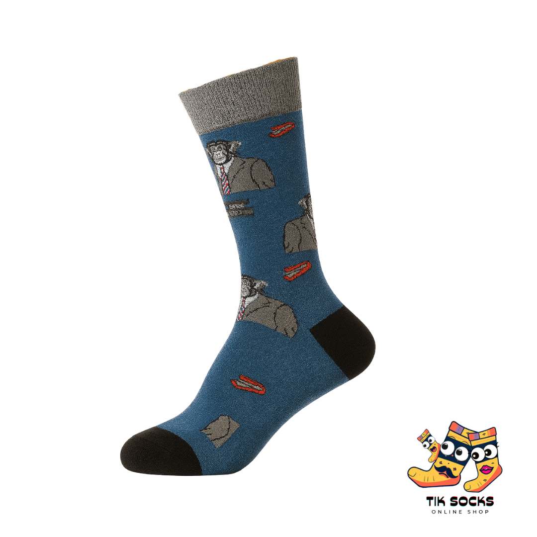 Blue sock with gray dog illustrations on a white background, featuring Tik Socks branding.