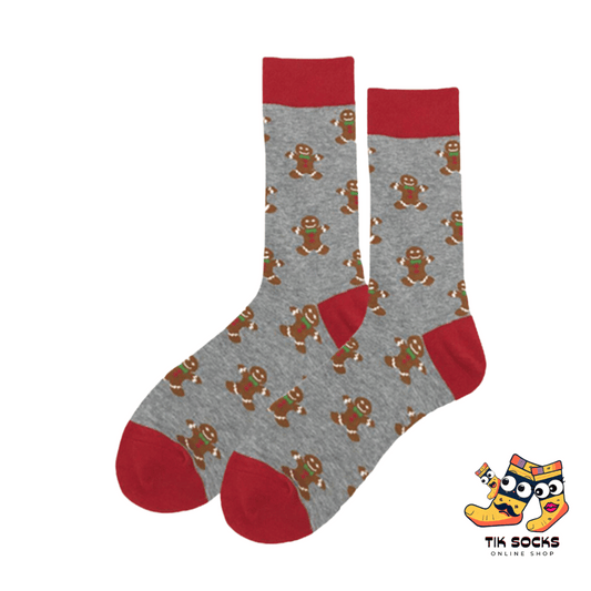 Men's and women's Christmas socks adorned with delightful gingerbread man illustrations, complete with icing details and festive accessories