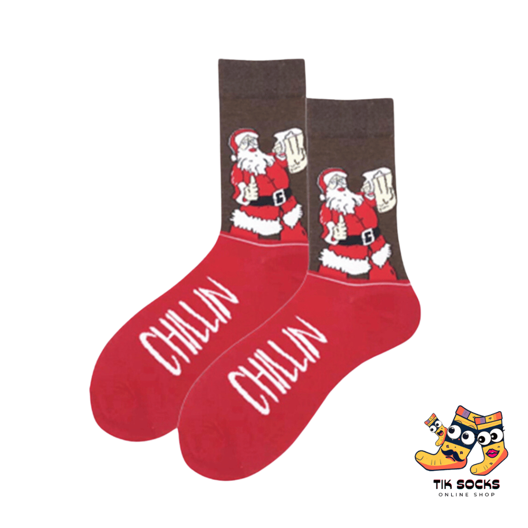 Men's and women's Christmas socks featuring a relaxed Santa Claus lounging with a 'chillin' vibe, capturing a laid-back holiday spirit