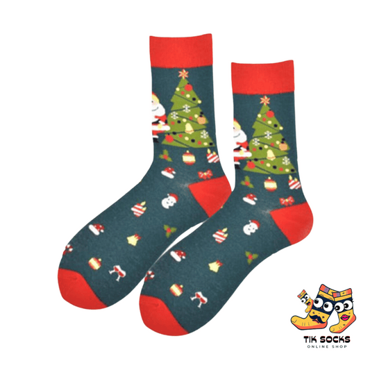 Men's and women's Christmas socks featuring a cheerful design of Santa Claus standing next to a decorated Christmas tree, capturing the holiday spiri