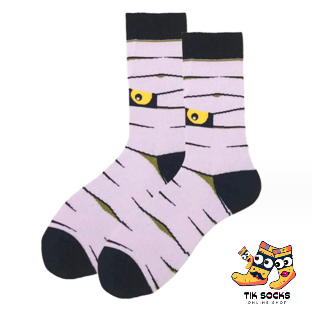 Soft cotton socks adorned with festive pumpkin designs, perfect for Halloween celebrations and gifting. Multiple images showcasing various Halloween-themed patterns for the holiday season