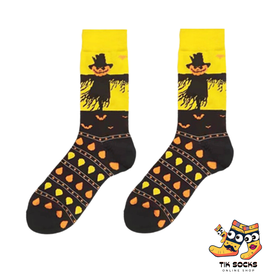 Men's and women's Halloween socks featuring a whimsical scarecrow theme with straw accents and pumpkin patch motifs