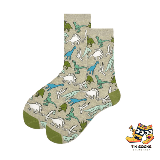 Men's and women's socks featuring various dinosaurs and iconic symbols from Jurassic Park, set against a prehistoric jungle backdrop