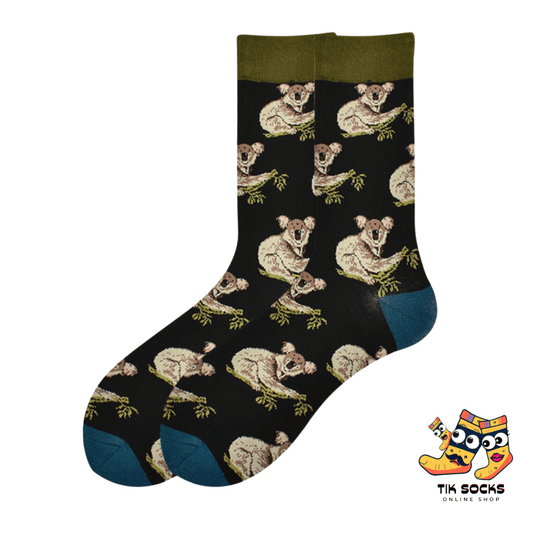 Men's and women's socks adorned with illustrations of koalas clinging to eucalyptus branches, set against a nature-inspired background
