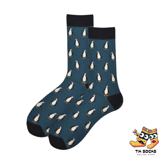 Men's and women's socks featuring adorable penguins, waddling or sliding, set against a snowy or icy blue background