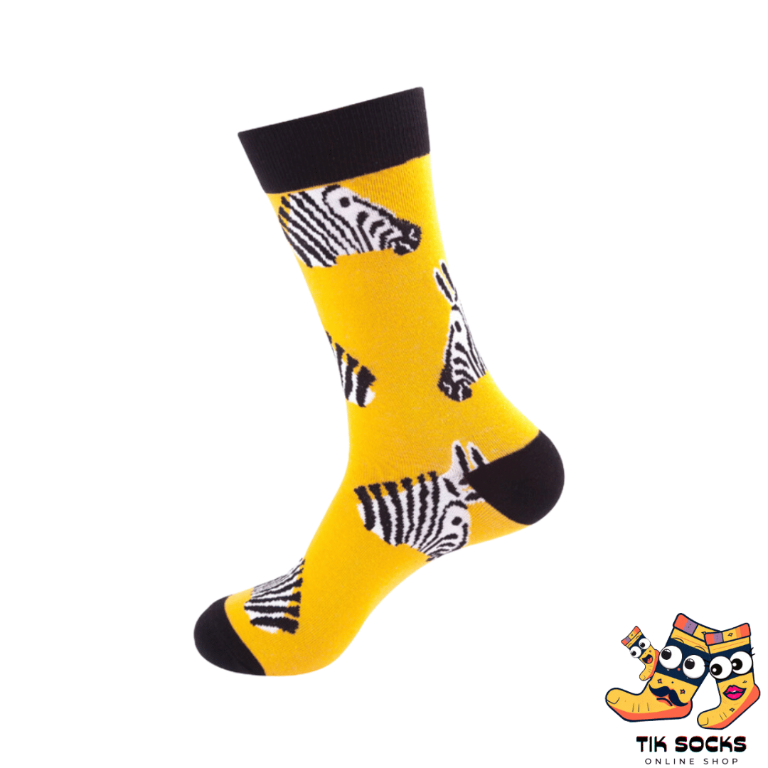 Pair of socks on a yellow background featuring a zebra design