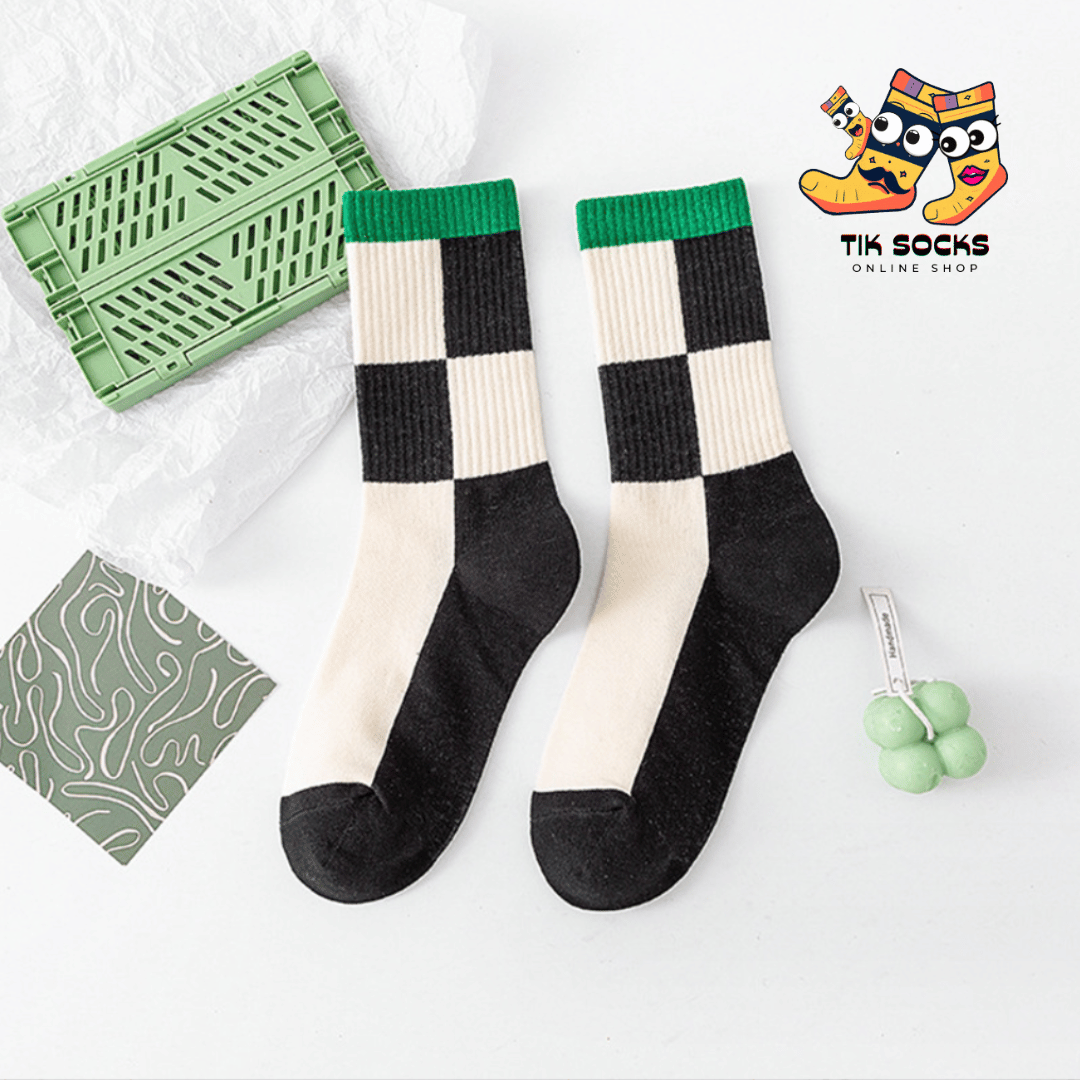 Socks with a black and white chessboard pattern, reflecting the timeless allure of classic board games and the latest fashion trends